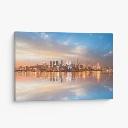 Cuadro en lienzo horizonte urbano reflejado al atardecer – Pixers®