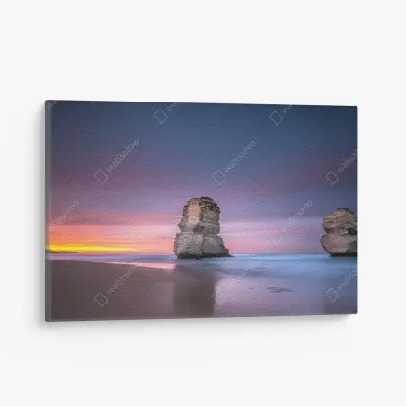 Cuadro en lienzo amanecer sobre pilares rocosos en la costa – Pixers®