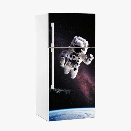 Pegatina para frigorífico astronauta flotando sobre la Tierra – Pixers®