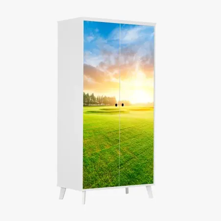 Pegatina para armario puesta de sol sobre campo verde y bosque – Pixers®