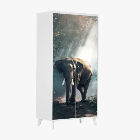 Pegatina para armario elefante entre rayos de luz en el bosque – Pixers®