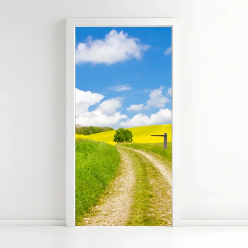 Pegatina para puerta camino entre prados amarillos y cielo azul