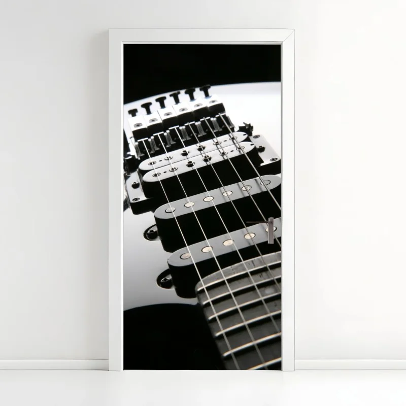 Pegatina para puerta guitarra eléctrica en primer plano sobre fondo negro