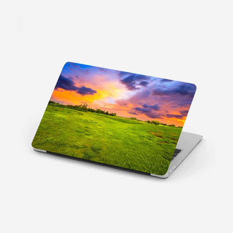 Pegatina para portátil paisaje de pradera al atardecer con cielo colorido