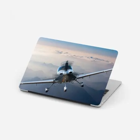 Pegatina para portátil avión monomotor sobre paisaje montañoso al amanecer – Pixers®