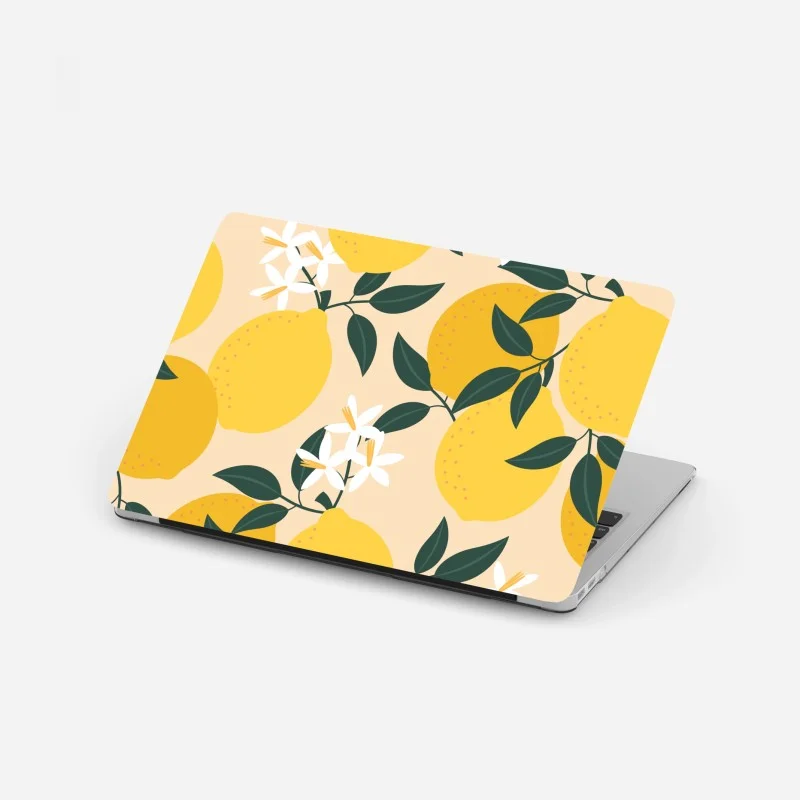 Pegatina para portátil diseño de limones y flores sobre fondo suave