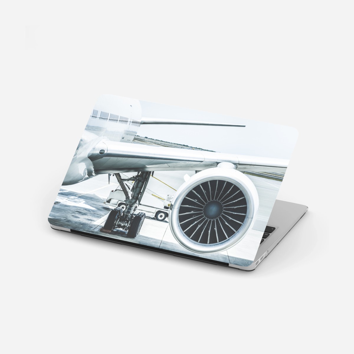 Pegatina para portátil motor de avión en la terminal: esencia de viaje – Pixers®