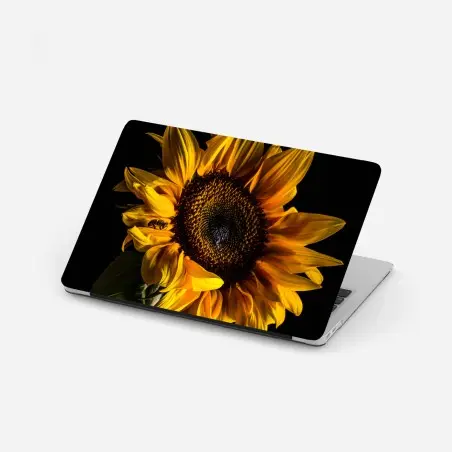 Pegatina para portátil girasol dorado en contraste sobre fondo negro – Pixers®