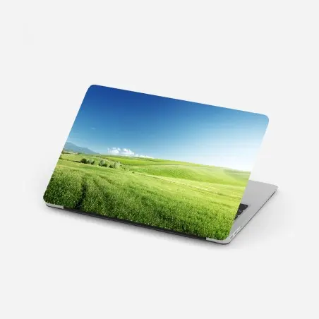 Pegatina para portátil colinas verdes bajo un cielo azul – Pixers®