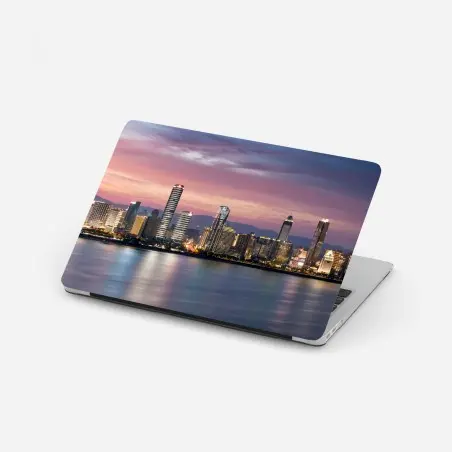Pegatina para portátil horizonte urbano al atardecer con reflejos – Pixers®