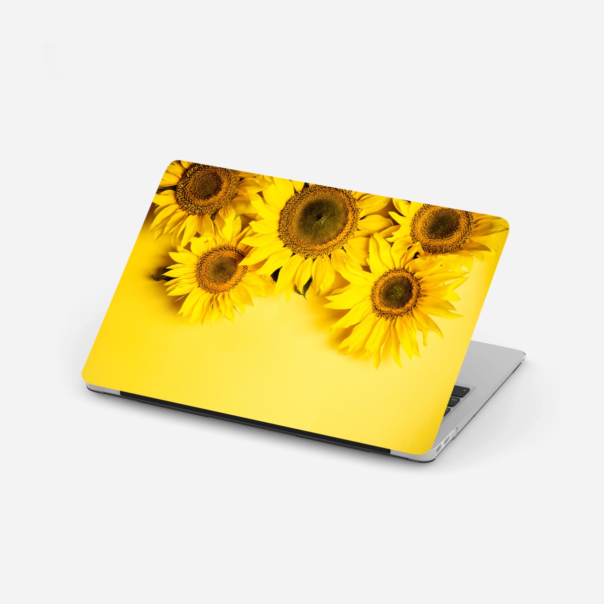 Pegatina para portátil girasoles sobre fondo amarillo – Pixers®