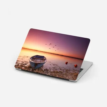 Pegatina para portátil barca azul en la orilla al amanecer – Pixers®