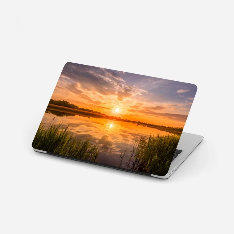 Pegatina para portátil puesta de sol dorada sobre el lago