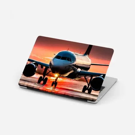 Pegatina para portátil avión al atardecer sobre la pista – Pixers®