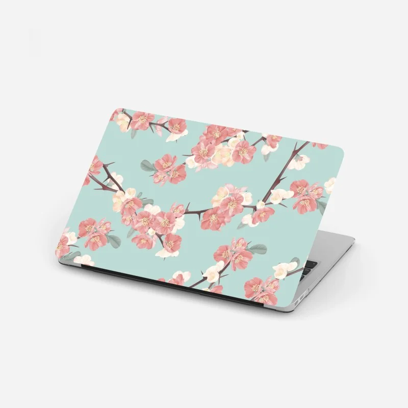 Pegatina para portátil diseño floral de flores de cerezo sobre fondo verde menta