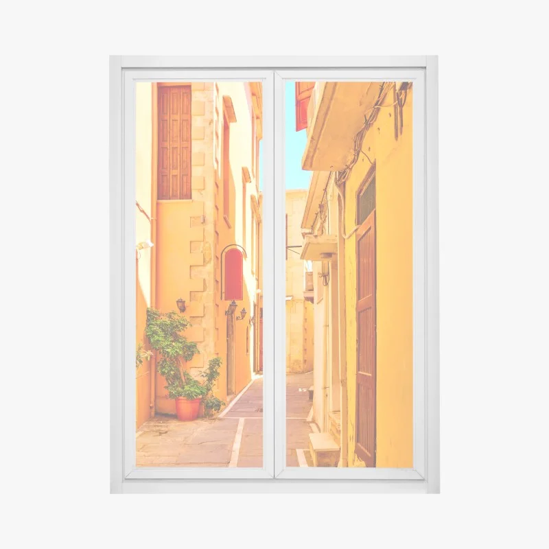 Pegatina para ventana calle estrecha de Rethymno bañada por el sol