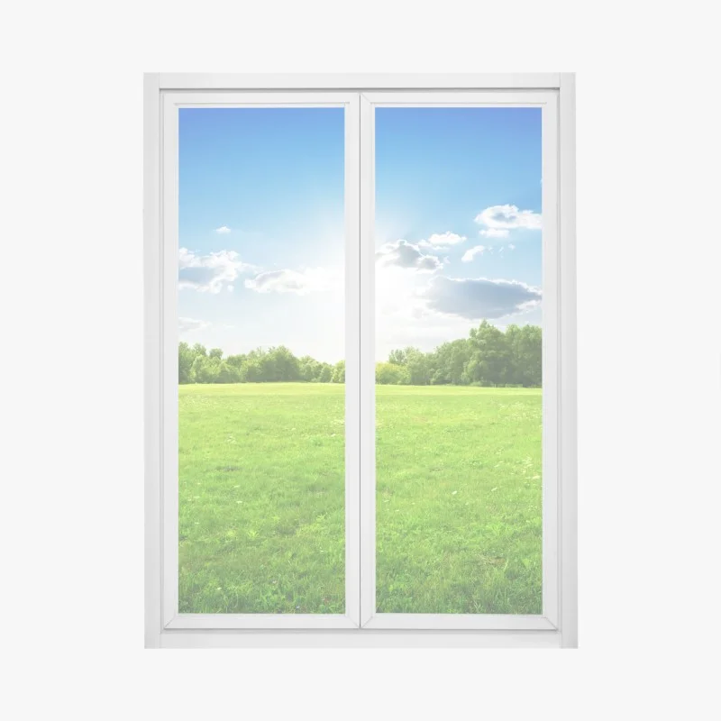 Pegatina para ventana amanecer sobre pradera verde y cielo azul