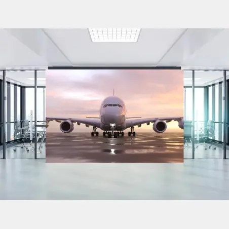 Fotomural avión frontal al atardecer en pista – Pixers®