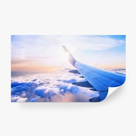 Fotomural vista aérea desde el ala del avión sobre nubes al amanecer – Pixers®
