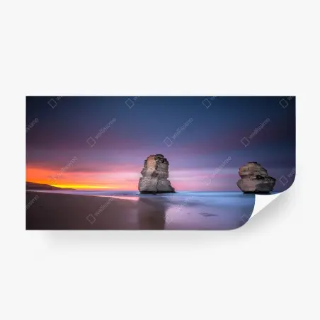 Fotomural amanecer sobre pilares rocosos en la costa – Pixers®