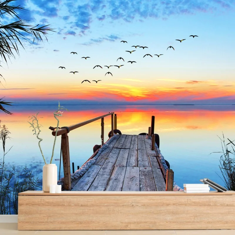 Fotomural muelle al amanecer sobre aguas tranquilas