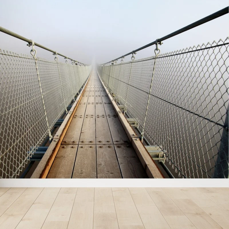 Fotomural puente colgante entre la niebla