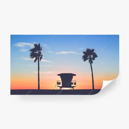 Fotomural puesta de sol en la playa con torre de salvavidas – Pixers®