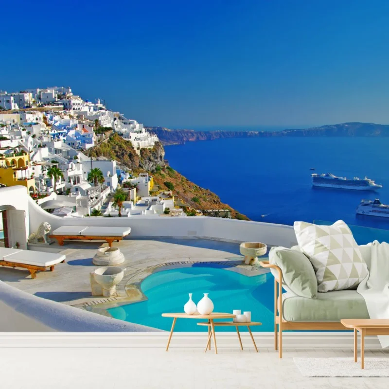 Fotomural panorámica de Santorini con piscina infinita y vistas al mar