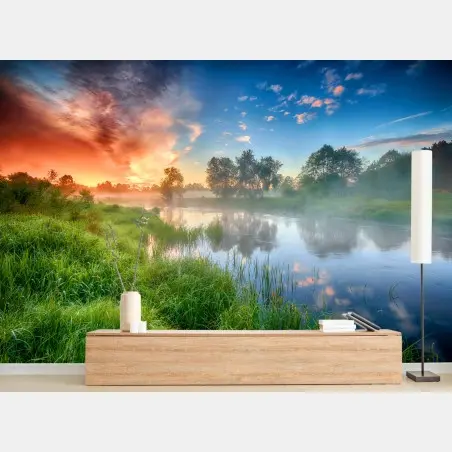 Fotomural amanecer dorado en la ribera del río – Pixers®