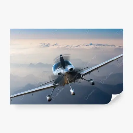 Fotomural avión monomotor sobre paisaje montañoso al amanecer – Pixers®