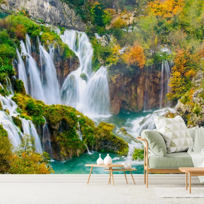 Fotomural cascada otoñal sobre aguas turquesa
