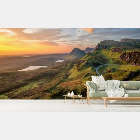 Fotomural amanecer en montañas verdes con carretera sinuosa – Pixers®