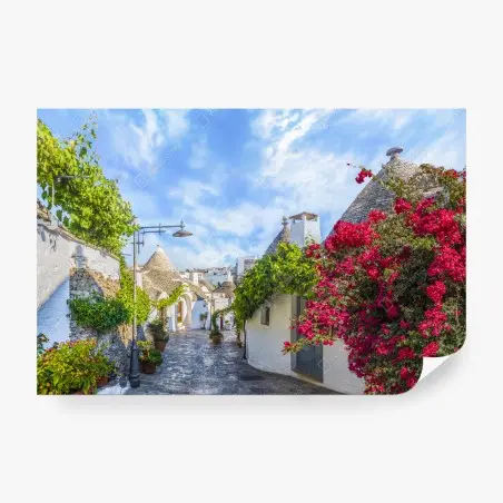 Fotomural encanto de Alberobello: trulli en calle empedrada con buganvillas – Pixers®