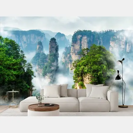 Fotomural paisaje de picos montañosos en la niebla – Pixers®