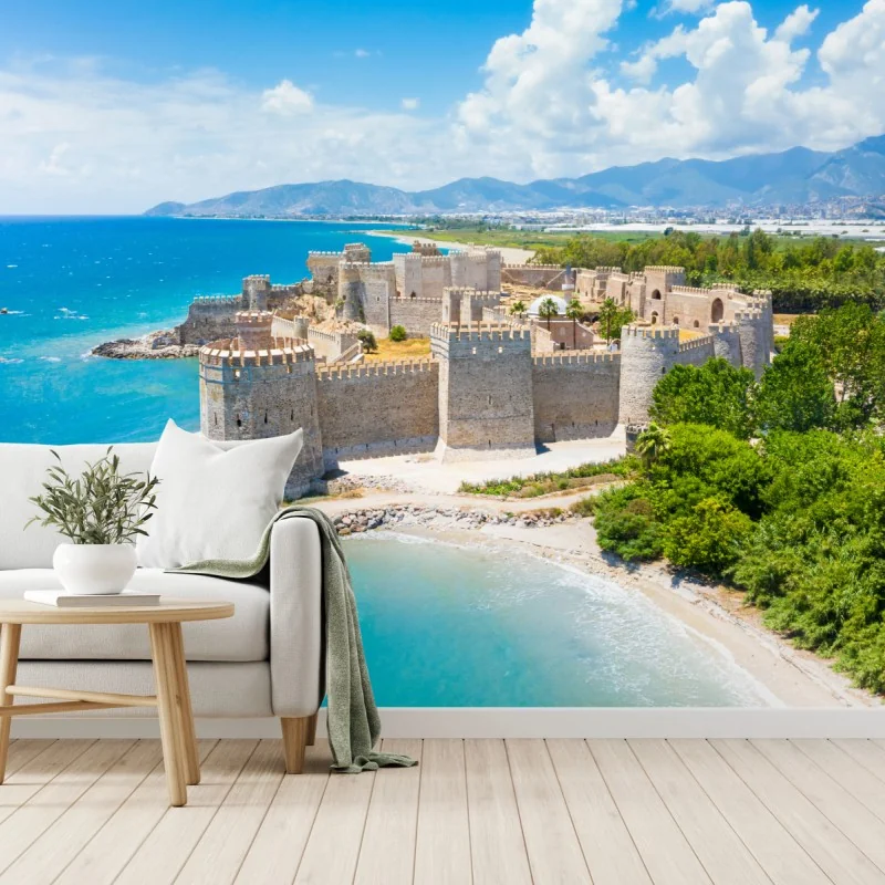 Fotomural castillo costero junto al mar turquesa