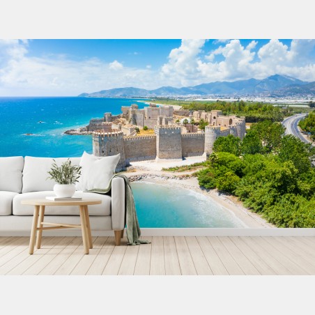 Fotomural castillo costero junto al mar turquesa – Pixers®