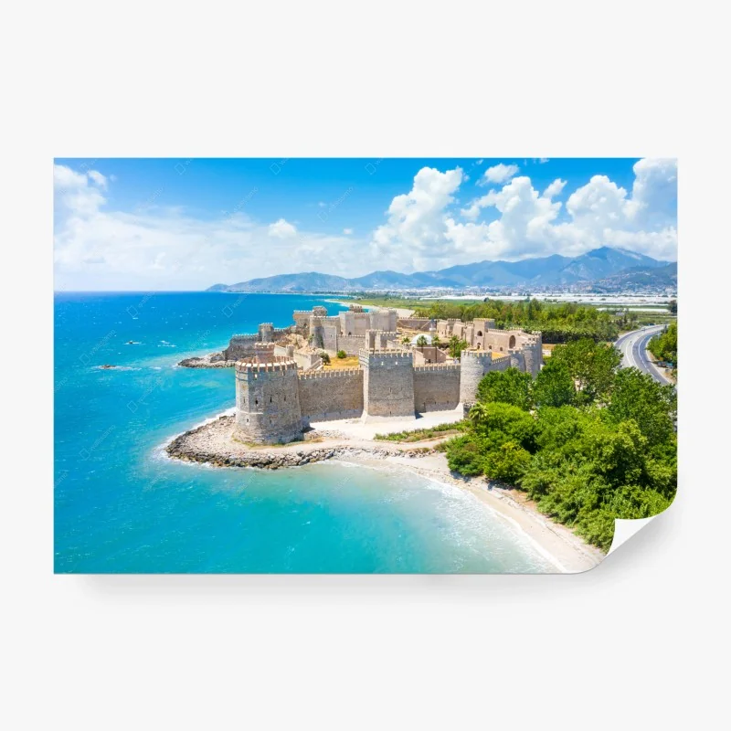 Fotomural castillo costero junto al mar turquesa