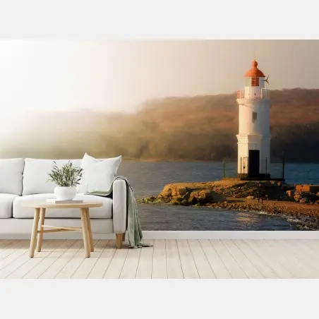 Fotomural faro solitario al borde del mar – Pixers®