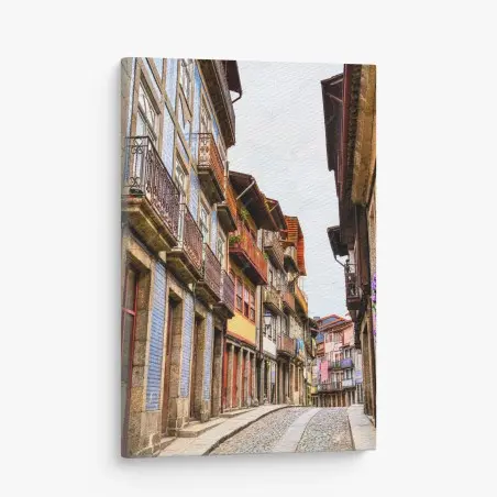 Cuadro en lienzo calle empedrada con fachadas coloridas y balcones tradicionales – Pixers®