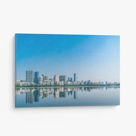 Cuadro en lienzo panorama urbano con reflejo en el agua – Pixers®
