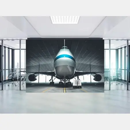 Fotomural frontal de avión en hangar industrial – Pixers®