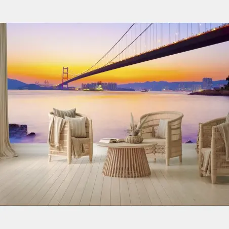 Fotomural puente colgante al atardecer sobre la costa – Pixers®