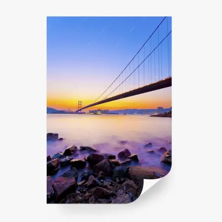Fotomural puente colgante al atardecer sobre la costa – Pixers®