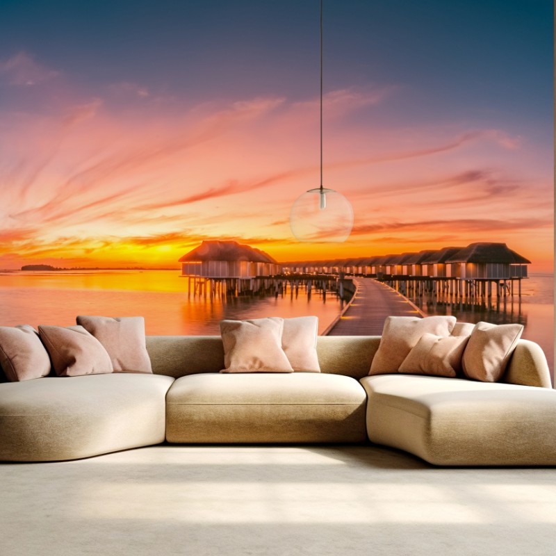 Fotomural pasarela hacia bungalows sobre el agua al atardecer