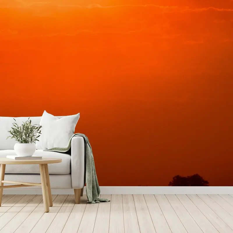 Fotomural atardecer naranja sobre el lago con silueta de bosque