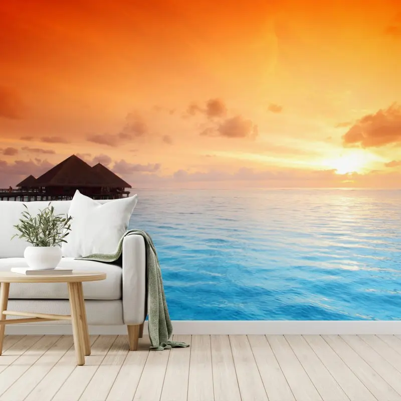 Fotomural puesta de sol tropical en bungalows sobre el agua